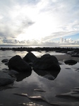 SX25198 Reflection of sun and clouds on Llanwit Major beach.jpg